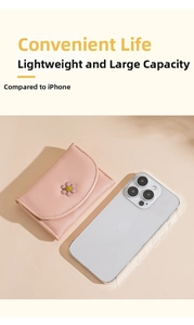 Pink daisy tri-fold wallet size comparison with an iPhone showing its compact thin design