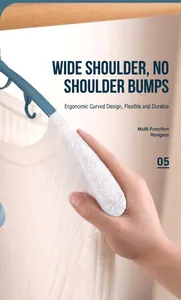 Blue ergonomic wide-shoulder clothes hanger showing non-marking curve for white knitwear