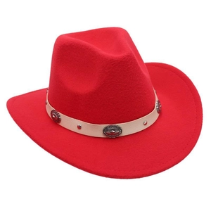 Macro view of bright red felt cowboy hat with cream leather strap and metal conchos