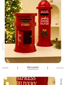 Close-up of red metal Christmas mailboxes with festive wreaths and holiday lights background