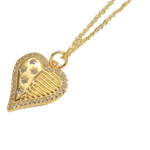 Asymmetric gold heart pendant necklace with radiant texture and zircon crystals