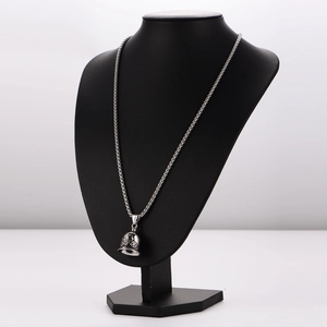 Vintage stainless steel motorcycle bell pendant on box chain displayed on a black mannequin