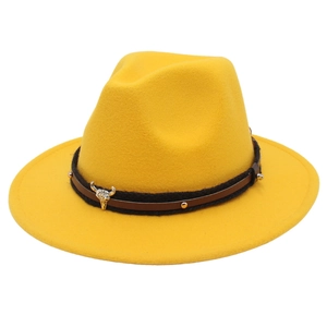 Bright yellow wool fedora hat with a leather strap and western bull head metal charm