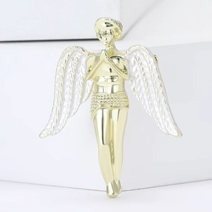 Minimalist gold alloy angel brooch with white enamel wings in a prayer pose