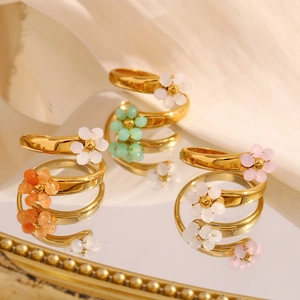 Detailed close-up of 18K gold plated floral wrap rings in four colorful beaded styles
