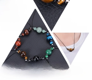 Detail of natural gemstone necklaces featuring 16mm round tiger eye and adjustable cords