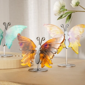 Handcrafted butterfly resin desktop ornament with translucent wings and metal stand base