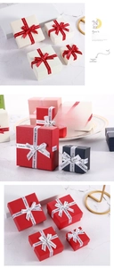 Macro detail of jewelry gift boxes with satin ribbons in red, white, blue and pink colors