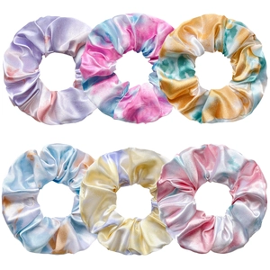 Detailed set of six tie-dye satin scrunchies in vibrant pastel mixed colors on white base