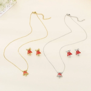 Detailed view of red bell necklaces and earrings with gold and silver reindeer motifs