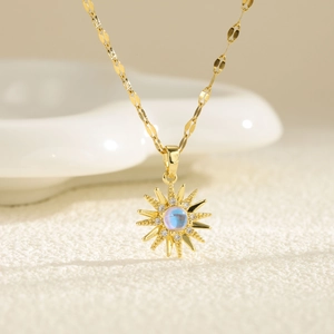 Golden sunburst necklace with moonstone and cubic zirconia on a chic sequin chain