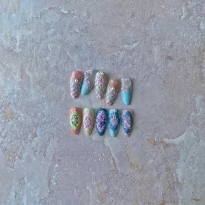 3D floral embossed press-on nails with roses and pearls in pink and blue tones