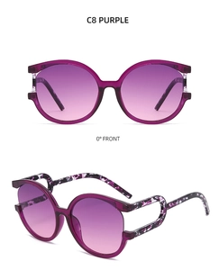 Detail view of round purple gradient sunglasses with stylish tortoiseshell temple patterns