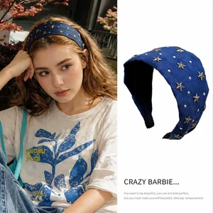 Detail of dark blue headband with gold star studs showing model wear and flat product view