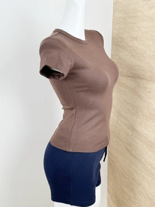 Side view of brown slim fit knitted T-shirt on a mannequin showing ribbed texture