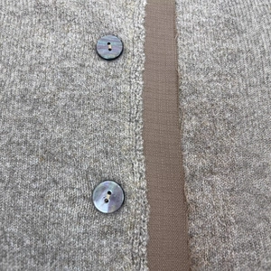 Chic off-the-shoulder knit cardigan with pearlized buttons and wool blend fabric