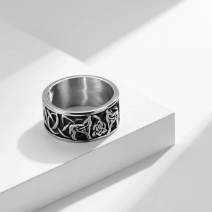 Macro view of Celtic knot and wolf totem engraving on vintage silver steel ring