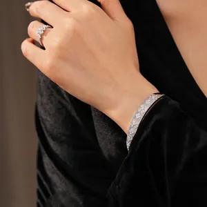 Silver clover flower jewelry set with zircon crystals, including ring and bangle