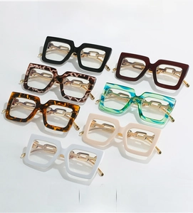 Detailed grid of oversized square frames with stylish gold chain temple decorations