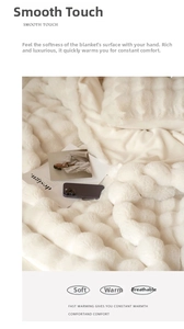 Detail of white faux fur throw blanket with 3D cloud texture and soft plush finish
