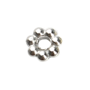 Close-up of silver CCB snowflake spacer bead with flower shape for DIY jewelry making
