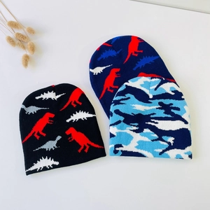 Set of warm infant knitted beanies with cute dinosaur prints and blue camouflage patterns