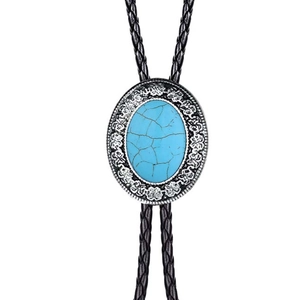 Detail of vintage Western bolo tie with blue turquoise gemstone and silver floral frame