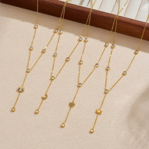 Gold plated Y-shaped necklaces with celestial pendants and cubic zirconia accents