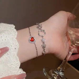 Zircon heart and Kitty charm double-layer bracelet set worn elegantly on a wrist