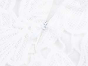 Close-up of invisible zipper on white floral lace fabric for sweet French style set