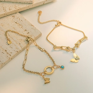 Bracelet Pendentif Papillon en Acier Titane Plaqué Or pour Femmes avec Chaîne en U Chiffres Romains Perle Bleue Bijoux