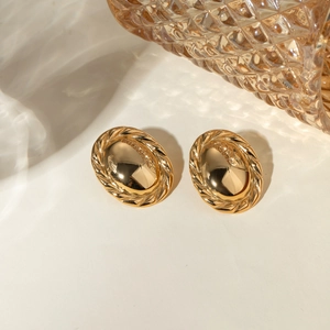Detailed view of 18k gold plated oval stud earrings with smooth center and textured rope edges