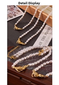 Detailed view of vintage pearl necklace featuring a golden handshake clasp and rice pearls