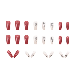 Deep red and cream press-on nails with LOVE letters and heart patterns in trapezoid shape