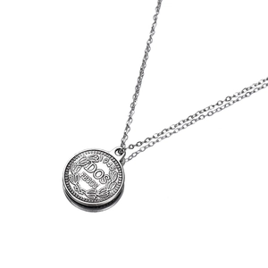Detail of silver alloy coin pendant featuring 1943 Dos Pesos relief and double layer chain