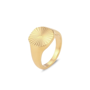 Detailed view of the gold-plated croissant ring featuring a radial texture pattern