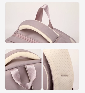 Detail of padded handles and breathable mesh back straps on the lavender school backpack