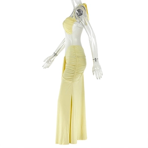 Detailed side view of yellow halter neck maxi dress with side ruching and cutout back