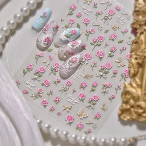 Dettagli di adesivi per unghie 3D con rose, farfalle e fiocchi dorati in rilievo