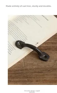 Detail of vintage cast iron door handle with heavy grainy texture and industrial design