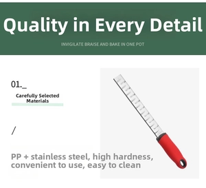 Detail of ergonomic red handle on a durable stainless steel zester for citrus and cheese