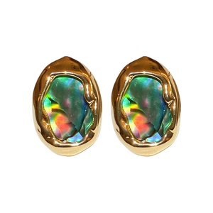 French vintage gold plated earrings with iridescent green shell inlay on white background