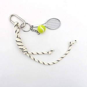 Tennis keychain with silver metal racket, green ball and black-white woven nylon strap