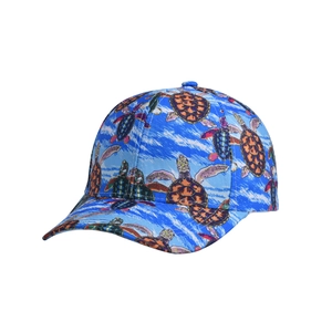 Detail of printed baseball cap featuring a vibrant blue background with colorful sea turtle patterns