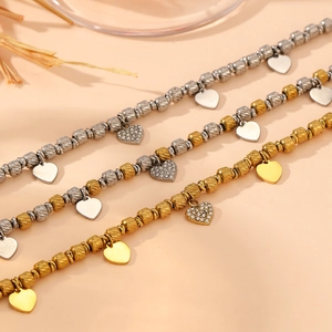 Three beaded stainless steel heart charm bracelets in gold, silver and mixed tones