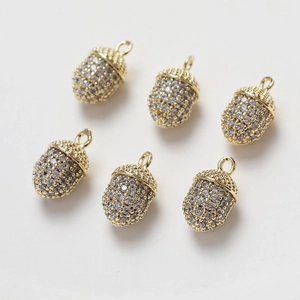 Detail of 14K gold plated squirrel pine cone charms with clear crystals for DIY jewelry