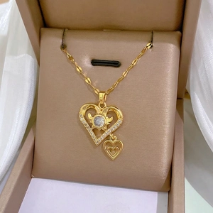 Elegant gold double heart necklace with sparkling zircon pendant on water wave chain