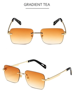 Detalle de gafas de sol cuadradas sin montura con lentes degradadas té y patillas de oro