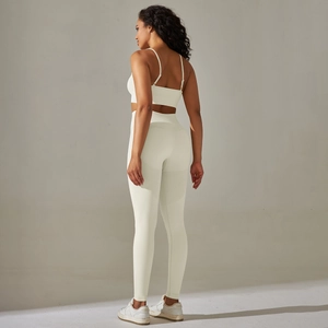 Detail view of seamless white high-waist leggings with breathable mesh and lifting texture