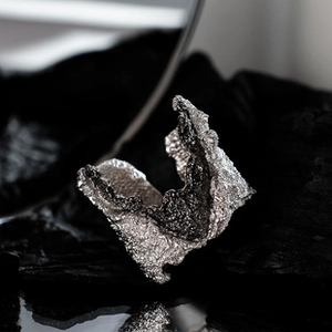 Artistic S925 sterling silver ring with unique molten lava texture on black stone
